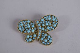 KENNETH LANE. A TURQUOISE BUTTERFLY BROOCH, signed.