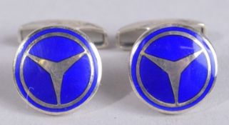 A PAIR OF STERLING SILVER MERCEDES CUFFLINKS.