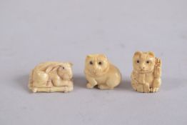 THREE SMALL CARVED BONE NETSUKES. 1ins.
