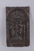 AN EARLY CARVED WOOD PANEL 