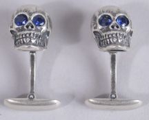A PAIR OF STERLING SILVER SKULL CUFFLINKS.