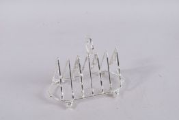 A SILVER PLATE SIX-DIVISION FOX HUNTING TOAST RACK.