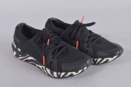 A PAIR OF STELLA McCARTNEY TRAINERS, size 39. Signs of wear.