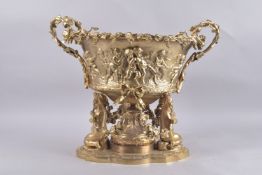 A GOOD GILT BRONZE OVAL TWO-HANDLED CHERUB BOWL with fruiting vines. 17ins high x 18ins diameter.