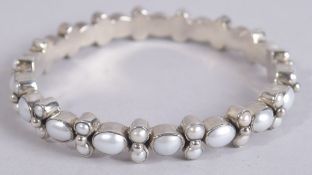A STERLING SILVER AND PEARL BANGLE.