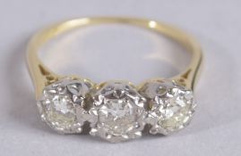 A CERTIFIED 18CT WHITE AND YELLOW GOLD RING set with 3 V S diamonds RBC diamonds, 0.65ct.