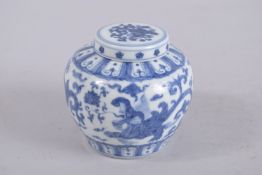 A CHINESE BLUE AND WHITE PORCELAIN JAR AND COVER. 9cm high.