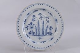 AN 18TH CENTURY ENGLISH BLUE AND WHITE TIN GLAZE CHARGER. 14ins.
