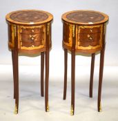 A PAIR OF LOUIS XVI STYLE INLAID CIRCULAR BEDSIDE TABLES with two drawers, on curving legs. 2ft 3ins
