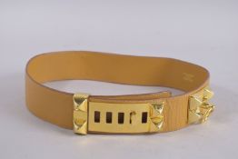 A HERMES TAN LEATHER BELT. 35ins long, in a Hermes bag and box.