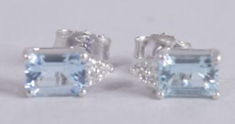 A PAIR OF 18CT GOLD, AQUAMARINE AND DIAMOND STUD EARRINGS.