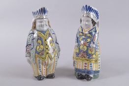 A GOOD PAIR OF POLYCHROME FIGURE JUGS. 11.5ins high.