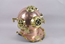A REPLICA BRASS DIVERS HELMET.