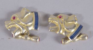 A PAIR OF RUSSIAN SILVER GILT DOG CUFFLINKS.