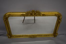 A LOUIS XVI STYLE GILTWOOD OVERMANTLE MIRROR. 4ft 4ins wide x 2ft 8ins high.