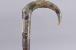 A SHOOTING WALKING STICK with bone handle. 35ins long.