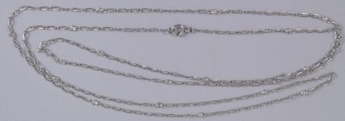 A PLATINUM AND DIAMOND LONG NECKLACE, Circa. 1920's, of delicate design, the chain interspersed with