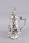 A LARGE W.M.F. SILVER PLATE STEIN decorated with cupids. 16ins high.