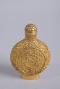 A CHINESE GILT BRONZE DRAGON SNUFF BOTTLE, 8cm high.