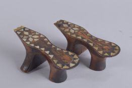 A PAIR OF 19TH CENTURY SYRIAN MOTHER OF PEARL INLAID HAMMAM SHOES, 21cm long.