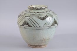 A PERSIAN GLAZED POTTERY JAR, 23cm high.