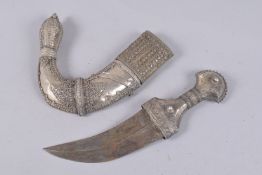 A LARGE OMANI WHITE METAL MOUNTED JAMBIYA, 38cm long.