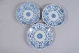 THREE 19THY CENTURY CHINESE BLUE AND WHITE PORCELAIN PLATES, (af), 20cm diameter.