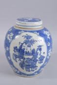 AN EARLY 20TH CENTURY CHINESE BLUE AND WHITE GINGER JAR AND COVER, 26cm high.