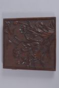 A FINE CARVED HARDWOOD PANEL, depicting birds and flora, approx. 25cm square.