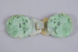 A FINE CHINESE CARVED JADEITE BELT BUCKLE, with chilong designs, 11cm wide (x2 pieces).