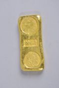 A CHINESE YELLOW METAL INGOT.