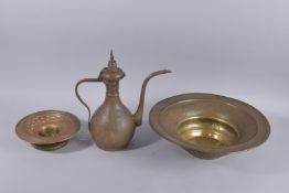 A FINE ISLAMIC ENGRAVED BRASS EWER AND BASIN, the body with various figures and calligraphy, ewer