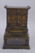A FINE JAPANESE MEIJI PERIOD GILDED BLACK LACQUER SECTIONAL MINIATURE CABINET, finely decorated with