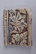 A FINE EARLY ISLAMIC POSSIBLY 14TH CENTURY COPPER LUSTRE BORDER TILE, 12cm wide.