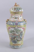 A 19TH CENTURY CHINESE YELLOW GROUND FAMILLE ROSE PORCELAIN JAR AND COVER, painted with two large