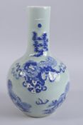 A CHINESE CELADON GROUND BLUE AND WHITE KYLIN VASE, 35cm high.