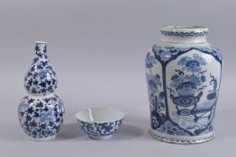 A CHINESE BLUE AND WHITE PORCELAIN GOURD VASE AND BOWL, each with character mark to base, together