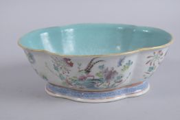 A CHINESE FAMILLE ROSE PORCELAIN QUATREFOIL PLANTER, painted with birds and flora, the interior with