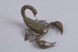 A PART-ARTICULATED BRONZE OKIMONO OF A SCORPION, 12cm long.