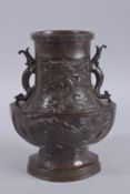 A FINE BRONZE TWIN HANDLE PHOENIX VASE, with relief decoration depicting a large carp, dragon, and