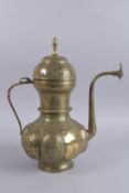 A LARGE 19TH CENTURY PERSIAN ENGRAVED BRASS EWER, with openworked foliate lid and panels, engraved