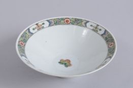 A 19TH CENTURY CHINESE FAMILLE VERTE PORCELAIN BOWL, painted with panels of flora with two red