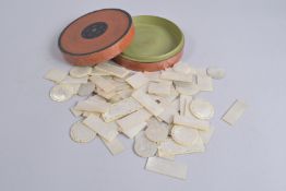 A COLLECTION OF CHINESE INCISED MOTHER OF PEARL COUNTERS, within a circular lacquer box, various