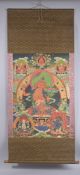 A TIBETAN THANGKA SCROLL.
