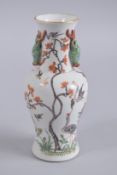 A 19TH CENTURY CHINESE FAMILLE VERTE PORCELAIN TWIN HANDLE VASE, 20.5cm high.