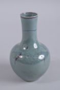 A CHINESE TURQUOISE FLAMBE GLAZE PORCELAIN VASE, 17cm high.
