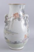A LARGE CHINESE FAMILLE VERTE TWIN HANDLE VASE, painted with a monkey on a branch within a vast