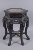 A 19TH CENTURY CHINESE MARBLE INSET CARVED HARDWOOD STAND, with pierced foliate frieze on five