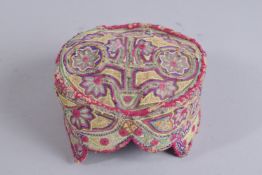 AN EMBROIDERED SILK HAT, with floral motifs.