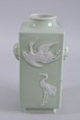 A CHINESE CELADON GLAZE PORCELAIN SQUARE FORM VASE WITH CRANES, 26cm high.